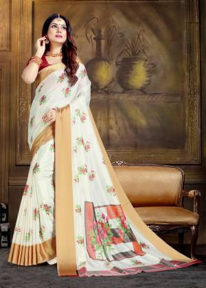 Simple Saree If Here For Your Semi-Casual Wear In White Color Paired With Red Colored Blouse. This Saree And Blouse Are Silk based Beautified With Prints All Over It. 