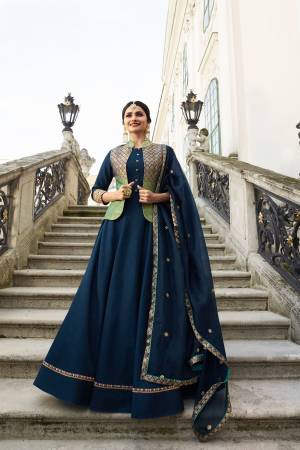 Enhance Your Personality Wearing This Designer Floor Length Readymade Gown In Navy Blue Color Paired With Navy Blue Colored Dupatta. Its Top Is Fabricated On Art Silk and Jacquard Silk Paired With Orgenza Fabricated Dupatta. 