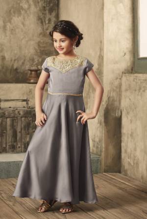 Flaunt Yourt Rich And Elegant Taste On You And Even On Your Daughter With This Elegant Looking Designer Floor Length Gown In Grey Color Fabricated On Satin. It Has Embroidered Yoke Giving It An Attractive Look. 