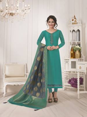 New Color Pallete Is Here With This Designer Semi-Stitched Suit In Sea Green Color Paired With Contrasting Grey Colored Dupatta.Its Top Is Fabricated On Muslin Silk Paired With Santoon Bottom And Banarasi Silk Dupatta. Buy Now.
