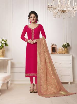 New Color Pallete Is Here With This Designer Semi-Stitched Suit In Dark Pink Color Paired With Contrasting Peach Colored Dupatta.Its Top Is Fabricated On Muslin Silk Paired With Santoon Bottom And Banarasi Silk Dupatta. Buy Now.