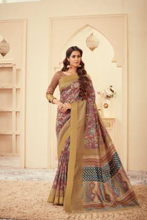 Grab This Silk Based Dusty Pink Colored Saree Paired With Beige Colored Blouse. This Saree And Blouse Are Beautified With Prints All Over It, Buy Now.