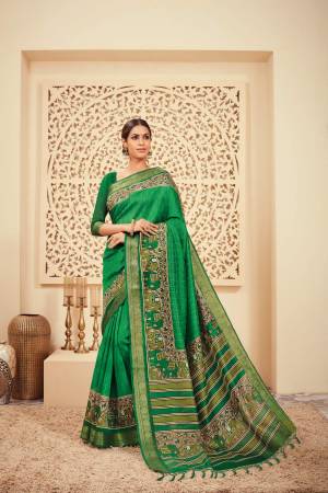 Celebrate This Festive Season With Ease And Comfort Wearing This Silk Based Saree In Green Color Paired With Green Colored Blouse. It Is Light Weight And easy To Drape. Buy Now.