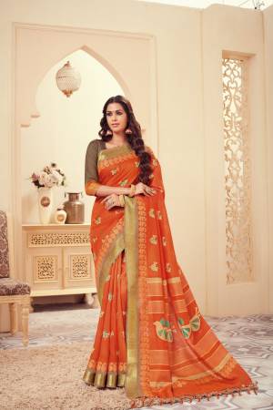 For Festive Feel, Grab This Silk Based Saree In Orange Color Paired With Contrasting Brown Colored Blouse. This Saree And Blouse Are Beautified With Simple Printed Motifs. 