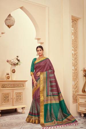New Shade Is Here To Add Into Your Wardrobe With This Silk Based Saree In Mauve Color Paired With Contrasting Green colored Blouse. It Has Pretty Simple Prints Over The Saree. Buy Now.