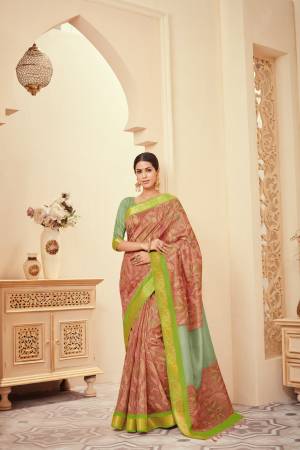Add This Beauty To Your Wardrobe In Light Brown Color Paired With Contrasting Mint Green Colored Blouse. This Saree And Blouse Are Fabricated On Art Silk Beautified With Prints.