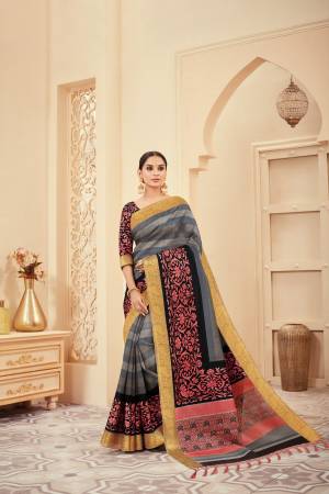 For A Bold and Beautiful Look, Grab This Rich Looking Saree In Dark Grey Color Paired With Black Colored Blouse. This Saree and Blouse are Fabricated On Art Silk Beautified With Prints All Over .