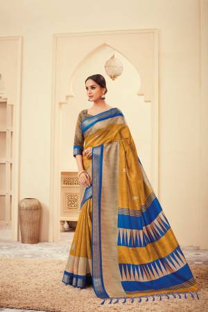 Celebrate This Festive Season With Ease And Comfort Wearing This Silk Based Saree In Musturd Yellow Color Paired With Musturd Yellow Colored Blouse. It Is Light Weight And easy To Drape. Buy Now.