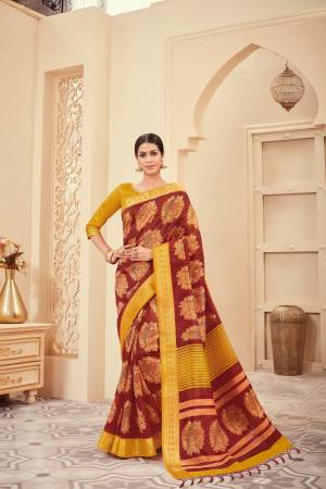 Flaunt Your Rich And Elegant Taste Wearing This Silk Based Saree In Maroon Color Paired With Musturd Yellow Colored Blouse. This Saree And Blouse are Beautified With Elegant Prints.