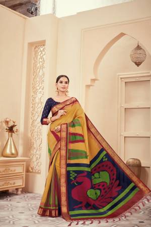 Celebrate This Festive Season With Ease And Comfort Wearing This Silk Based Saree In Musturd Yellow Color Paired With Navy BLue Colored Blouse. It Is Light Weight And easy To Drape. Buy Now.