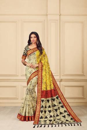 Add This Beauty To Your Wardrobe In Cream And Yellow Color Paired With Cream And Black Colored Blouse. This Saree And Blouse Are Fabricated On Art Silk Beautified With Prints.