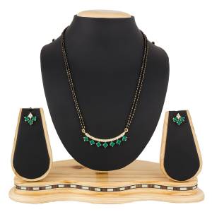 Give An Elegant Look To Your Neckline With This Rich Designer Mangalsutra Set Beautified With Diamond Work. Also It Comes With A Pair OF Earrings. Pair This Up With Any Colored Attire, Be It Casual Or Heavy. 