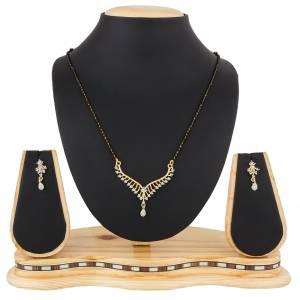Give An Elegant Look To Your Neckline With This Rich Designer Mangalsutra Set Beautified With Diamond Work. Also It Comes With A Pair OF Earrings. Pair This Up With Any Colored Attire, Be It Casual Or Heavy. 