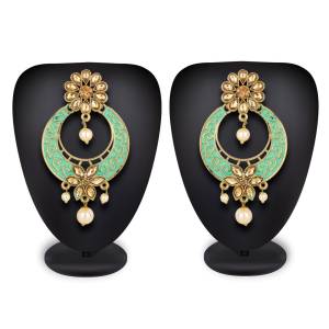 Here Is A Lovely Pair Of Earrings In Golden Color With Sky Blue Highlight And Stone Work. This Can Be Paired With Any Heavy Attire Or A Simple Kurti .
