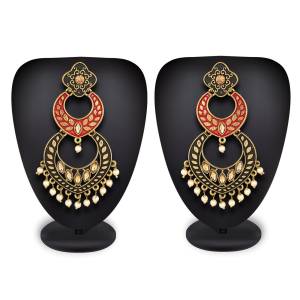 If Heavy IS Your Choice Than Grab This Pair Of Earrings In Red And Black Color Beautified With Stone Work. It Is Light Weight And Easy To Carry All Day Long.