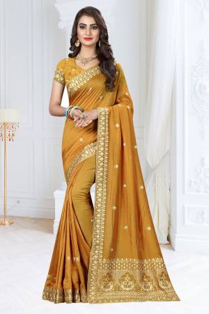 Celebrate This Festive Season Wearing This Designer Saree In Musturd Yellow Color Paired With Musturd Yellow Colored Blouse. This Saree And Blouse Are Fabricated On Soft Silk Beautified With Jari Work .