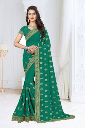 Celebrate This Festive Season Wearing This Designer Saree In Sea Green Color Paired With Sea Green Colored Blouse. This Saree And Blouse Are Fabricated On Georgette Beautified With Jari Work .