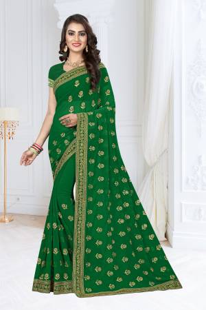 Get Ready For The Upcoming Festive And Wedding Season With This Designer Saree In Green Color Paired With Green Colored Blouse, This Georgette based Saree In Easy To Drape And Durable.