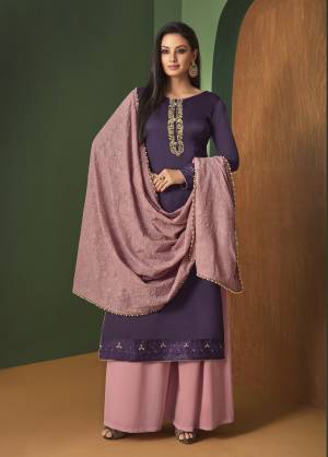 Here Is A Beautiful Designer Suit In Purple Colored Top Paired With Contrasting Baby Pink Colored Bottom And dupatta. Its Top Is Satin Georgette Fabricated Paired With Georgette Bottom And Dupatta. Its Lovely Color Pallet Will Earn You Lots Of Compliments From Onlookers.