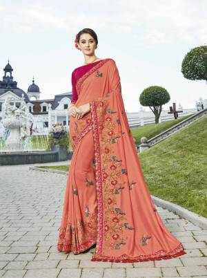 A Must Have Shade In Every Womens Wardrobe Is Here With This Designer Saree In Peach Color Paired With Contrasting Rani Pink Colored Blouse. It Is Easy To Drape And Easy To Care For. 