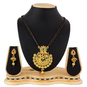 Here Is A Heavy Patterned Mangalsutra In Golden Color With Pretty Set Of Earrings. This Mangalsutra Is Suitable For Function OR Wedding Wear. It Can Be Paired With Any Colored Attire. 