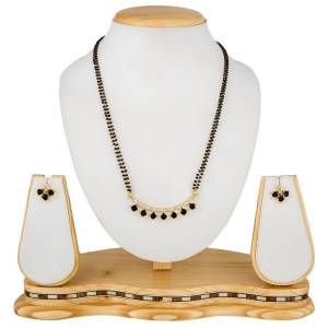Give An Elegant Look To Your Neckline With This Rich Designer Mangalsutra Set Beautified With Diamond Work. Also It Comes With A Pair OF Earrings. Pair This Up With Any Colored Attire, Be It Casual Or Heavy