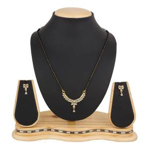 Instead Of Those Heavy Necklace, Carry This Beautiful And Elegant Looking Mamgalsutra Set At The Next Party You Attend. It Is Beautified With Diamond Work And You Can Pair This Up With Any Colored Attire.