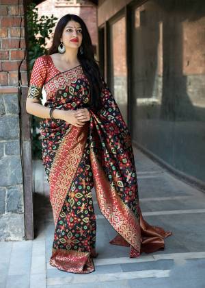 For A Bold And Beautiful Look, Grab This Designer Silk Based Saree In Black Color Paired With Maroon Colored Blouse. This Saree And Blouse Are Fabricated On Art Silk Beautified With Weave All Over It. Buy Now.