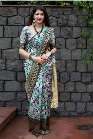 Flaunt Your Rich And Elegant Taste Wearing This Lovely Grey Colored Saree Paired With Grey Colored Blouse. This Saree And Blouse Are Silk based Beautified With Weave All Over It. Buy Now.