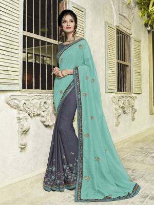 Presenting this Turquoise Blue and grey color silk fabrics and moss chiffon saree. Ideal for party, festive & social gatherings. this gorgeous saree featuring a beautiful mix of designs. designer embroidered saree, patch design, stone, heavy designer blouse, two color sarees, beautiful floral design Comes along with a contrast unstitched blouse.