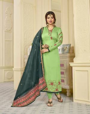 Add This Very Beautiful Designer Suit To Your Wardrobe In Light Green Colored Top And Bottom Paired With Dark Green Colored Dupatta.Its Top Is Georgette Satin Based Paired With Santoon Bottom And Orgenza Silk Dupatta. 