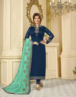 Shine Bright Wearing This Beautiful Designer Suit In Dark Blue Color Paired With Sea Green Colored Dupatta. Its Top Is Fabricated On Georgette Satin Paired With Santoon Bottom And Orgenza Silk Dupatta. Buy Now.