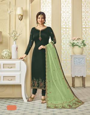 This Season Is About Bright And Attractive Colors, So Grab This Beautiful Designer Suit In Dark Green Colored Top And Bottom Paired With Light Green Colored Dupatta. Its Top Is Fabricated On Georgette Satin Paired With Santoon Bottom And Oragenza Silk Dupatta. All Its Fabric Ensures Superb Comfort All Day Long.