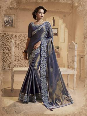 Enhance Your Personality Wearing This Designer Saree In Navy Blue Color Paired With Navy Blue Colored Blouse, This Saree And Blouse Are Fancy Silk Based Beautified With Heavy Embroidered Lace Border. Buy Now.