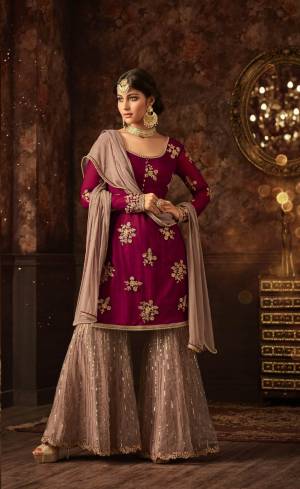 Add This Very Pretty Sharara Dress In Magenta Pink Colored Top Paired With Mauve Colored Bottom And Dupatta. Its Top And Bottom Are Net Based Paired With Chiffon Fabricated Dupatta. Its Pretty Color Combination And Embroidery Will Earn You Lots Of Compliments From Onlookers. Buy Now.