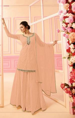 Here Is A Beautiful Indo-Western Dress In Subtle Shades. Its Top, Bottom And Dupatta Are In Pretty Peach Color. It Is Fabricated On Georgette Paired with Chiffon Dupatta. Buy This Designer Indo-Western Dress Now. 