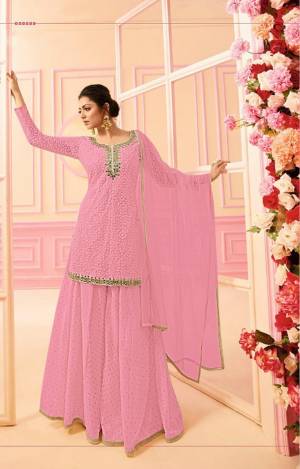 Here Is A Beautiful Indo-Western Dress In Subtle Shades. Its Top, Bottom And Dupatta Are In Pretty Powder Pink Color. It Is Fabricated On Georgette Paired with Chiffon Dupatta. Buy This Designer Indo-Western Dress Now. 