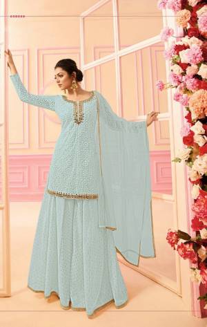 Here Is A Beautiful Indo-Western Dress In Subtle Shades. Its Top, Bottom And Dupatta Are In Pretty Baby Blue Color. It Is Fabricated On Georgette Paired with Chiffon Dupatta. Buy This Designer Indo-Western Dress Now. 