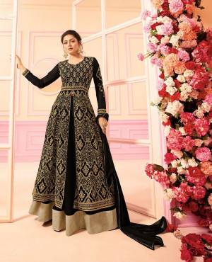For A Heavy Look, Grab This Heavy Designer Indo-Western Dress In Black Color Paired With Black Colored bottom And Dupatta. Its Top And Bottom Are Georgette Based Paired With Chiffon Dupatta. Buy Now.
