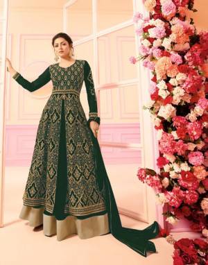 For A Heavy Look, Grab This Heavy Designer Indo-Western Dress In Dark Green Color Paired With Dark Green Colored bottom And Dupatta. Its Top And Bottom Are Georgette Based Paired With Chiffon Dupatta. Buy Now.