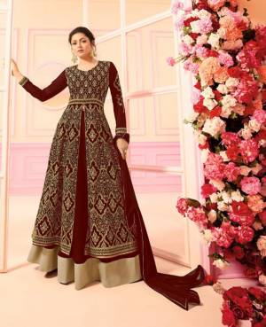 For A Heavy Look, Grab This Heavy Designer Indo-Western Dress In Maroon Color Paired With Maroon Colored bottom And Dupatta. Its Top And Bottom Are Georgette Based Paired With Chiffon Dupatta. Buy Now.