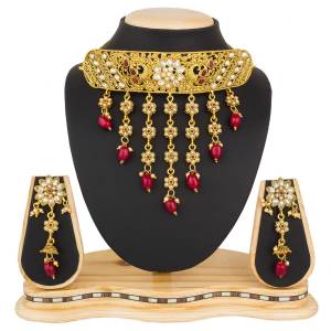 Grab This Beautiful And Attractive Looking Heavy Choker Necklace Set In Golden Color Paired With Heavy Earrings Set. This Set Is Beautified With Stone And Moti Work. It Can Be Paired With Any Colored Traditional Attire. Buy Now.