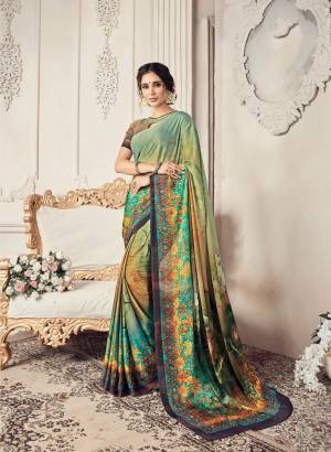Simple Saree Is Here For Your Semi-Casuals. Grab This Saree In Light Green Color Paired With Light Green Colored Blouse. This Saree And Blouse Are Fabricated On Georgette Beautified With Prints. 