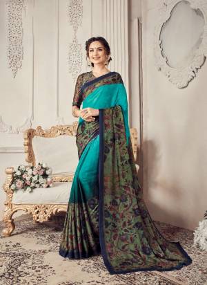 You Will Definitely Earn Lots Of Compliments Wearing This Pretty Saree In Blue And Dark Green Color Paired With Dark Green Colored Blouse, It Is Light In Weight And Its Fabric Ensures Superb Comfort All Day Long.