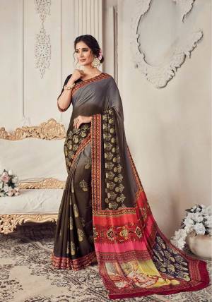 Flaunt Your Rich And Elegant Taste Wearing This Beautiful Saree In Dark Grey And Brown Color Paired With Black Colored Blouse. This Saree And Blouse Are Georgette Based Beautified With Prints. 