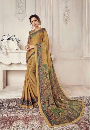 Simple Saree Is Here For Your Semi-Casuals. Grab This Saree In Beige Color Paired With Beige Colored Blouse. This Saree And Blouse Are Fabricated On Georgette Beautified With Prints. 