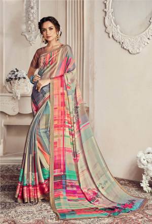 Go Colorful With This Very Pretty Multi Colored Saree Paired With Multi Colored Blouse. This Saree Is Georgette Based Beautified With Small And Bold Prints All Over It. Buy Now.