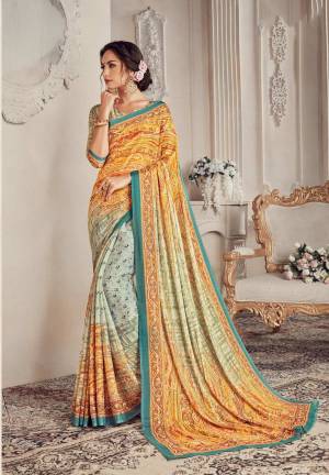 Here Is A Very Pretty Elegant Looking Shade With This Saree In Yellow And Off-White Color Paired With Cream Colored Blouse. This Saree And Blouse Are Georgette Based Beautified With Lining And Floral Prints. 