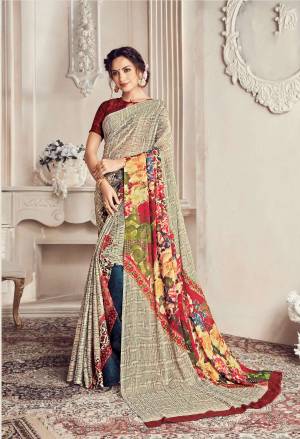 Here Is A Very Pretty Elegant Looking Shade With This Saree In Off-White And Multi Color Paired With Maroon Colored Blouse. This Saree And Blouse Are Georgette Based Beautified With Lining And Floral Prints. 