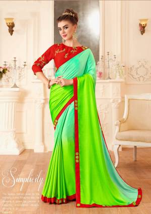 Look Attractive In This Beautiful Designer Saree In Sea Green And Parrot Green Color Paired With Contrasting Red Colored Blouse. This Saree And Blouse Are Silk Based Beautified With Jari And Thread Work. Buy This Saree Now.